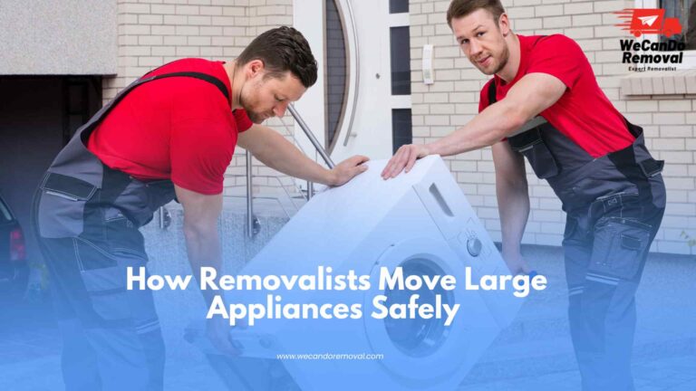 Professional movers safely moving large appliances with protective equipment.